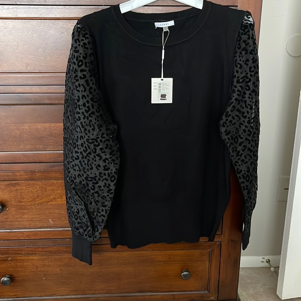 Black soft sweater with sheer leopard detail sleeves